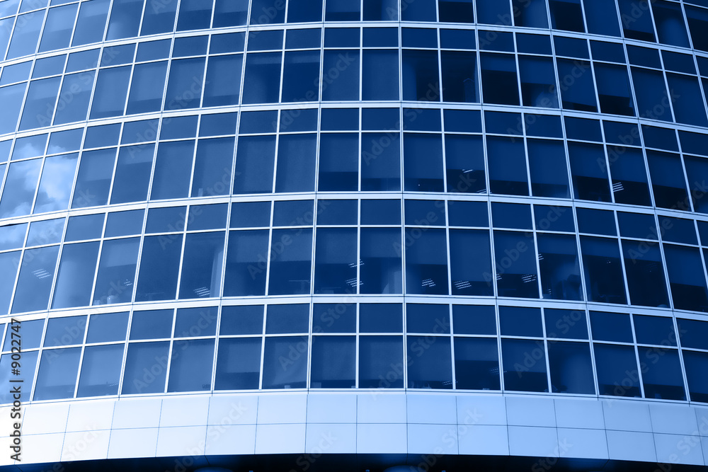 Modern skyscrapers close-up toned in blue color