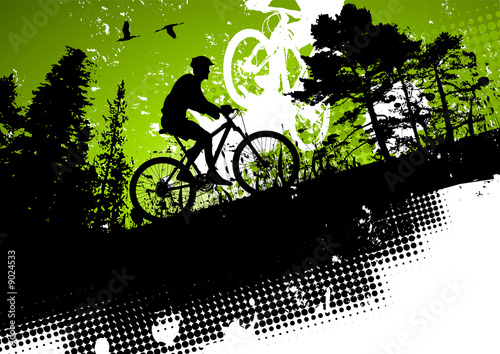 Fototapeta Naklejka Na Ścianę i Meble -  Mountain bike in a forest abstract background