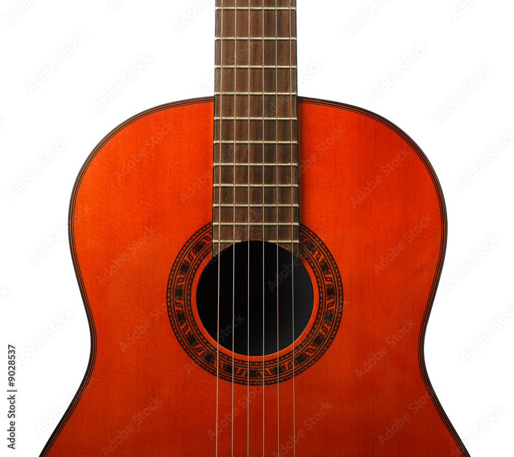 Acoustic six-string guitar. Covered by a brown varnish Acoustic six-string guitar. Covered by a brown varnish