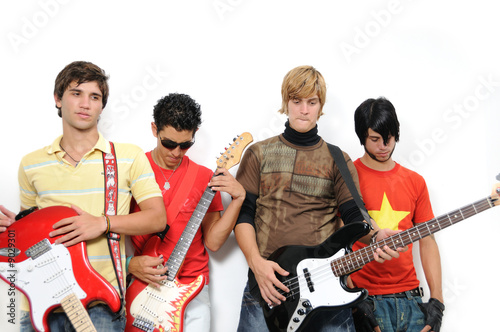 Portrait of young trendy group with musical intruments photo