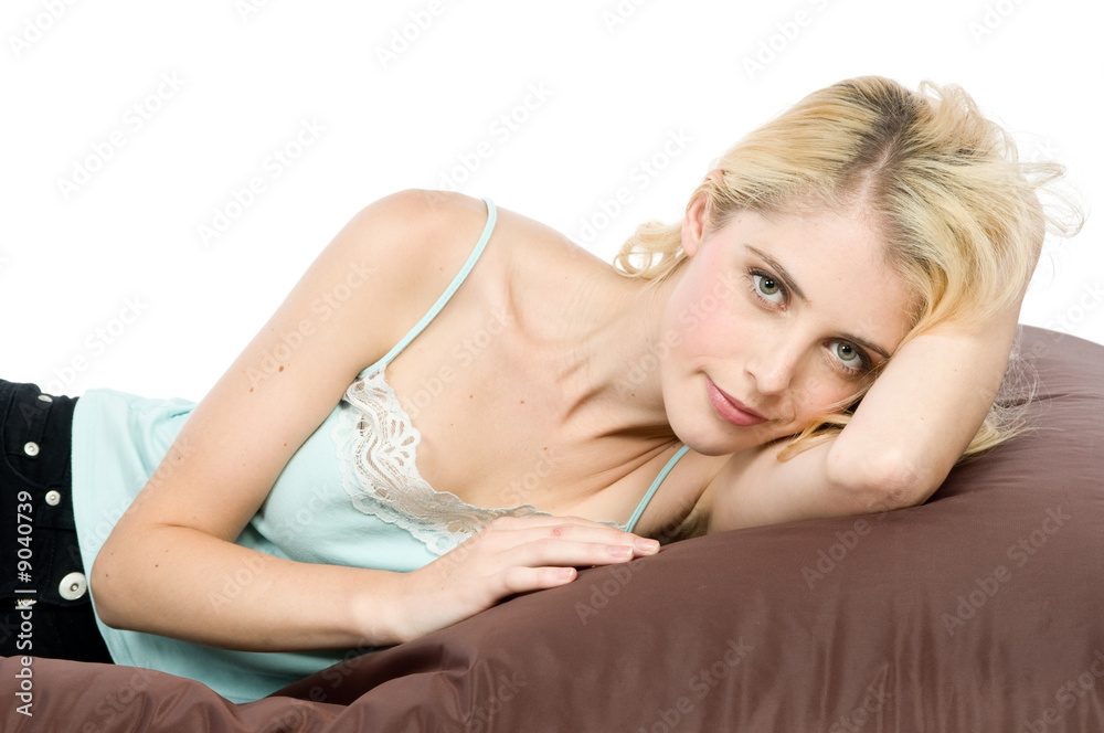 An attractive young woman relaxed on a beanbag An attractive young woman relaxed on a beanbag