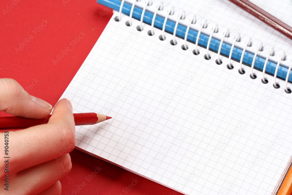 Close-up of pencil and agenda Close-up of pencil and agenda