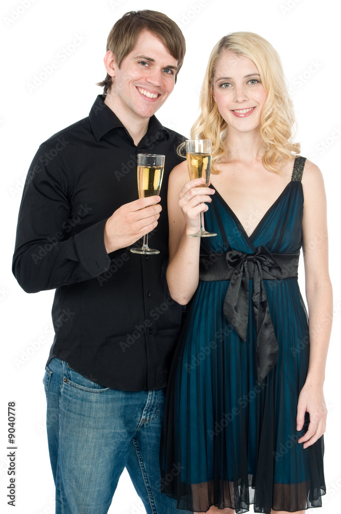 An attractive young couple drinking champagne together An attractive young couple drinking champagne together