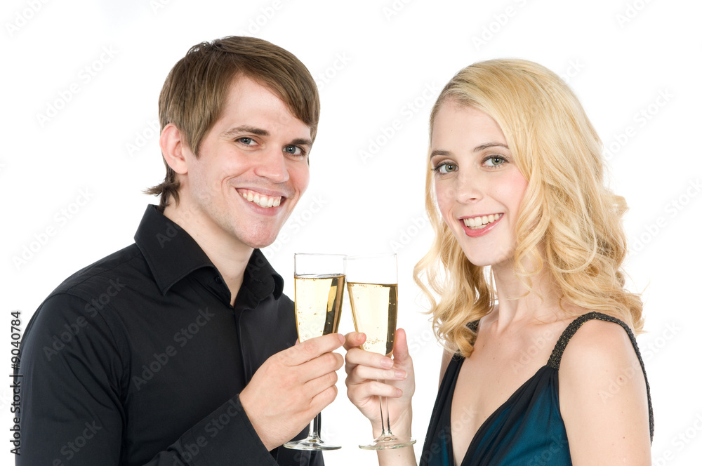 An attractive young couple drinking champagne together An attractive young couple drinking champagne together