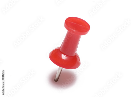 Red thumb tack isolated on white background