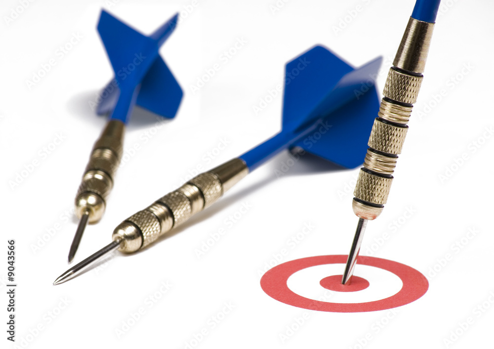 Blue dart hitting the target showing bull's eye Blue dart hitting the target showing bull's eye