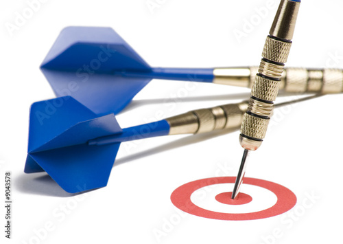 Blue dart hitting the target showing bull's eye