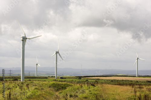 wind turbine electicity generator towers in summer