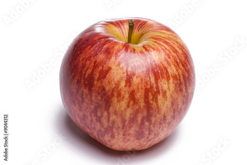 Vibrant red apple isolated on white background