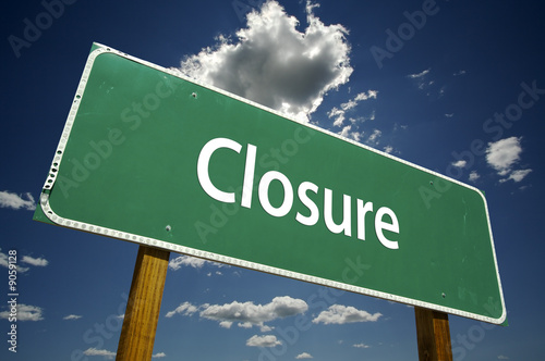 Closure Road Sign with dramatic clouds and sky. photo