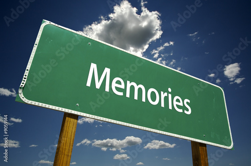 Fotografia Memories Road Sign with dramatic clouds and sky.