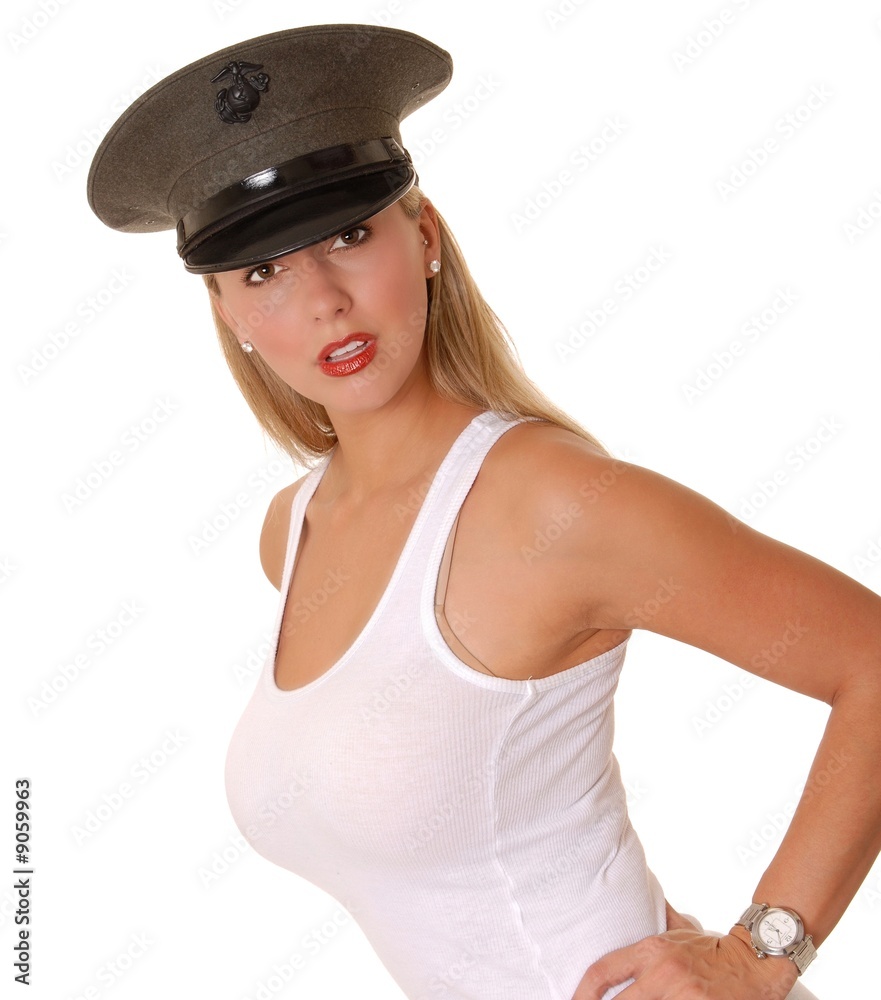Isolated lovely and sexy young blond girl wearing a Marine cap Isolated lovely and sexy young blond girl wearing a Marine cap