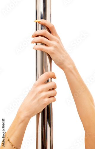 female hands hold on to pole over white
