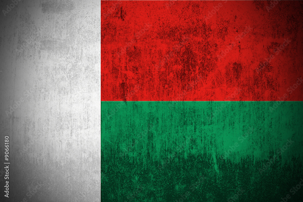 Weathered Flag Of Madagascar, fabric textured.. Weathered Flag Of Madagascar, fabric textured..