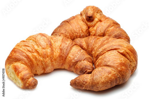 Three fresh croissant isolated over white background