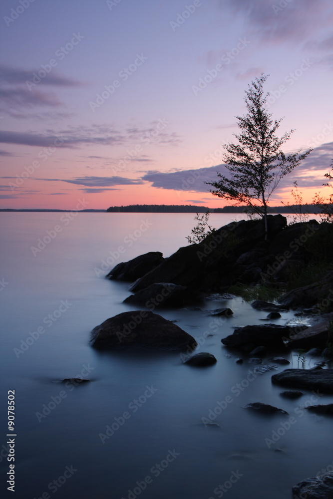 Sunset by the lake, rocks, long exposure