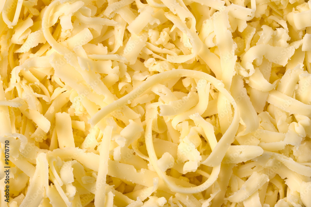 Grated pizza cheese (mozarella ) close up Grated pizza cheese (mozarella ) close up