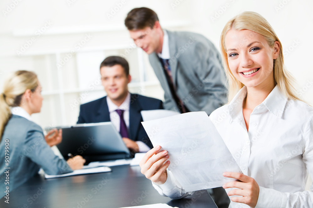 Portrait of white collar worker holding document Portrait of white collar worker holding document