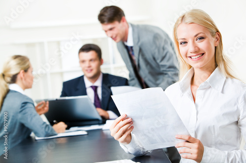 Portrait of white collar worker holding document