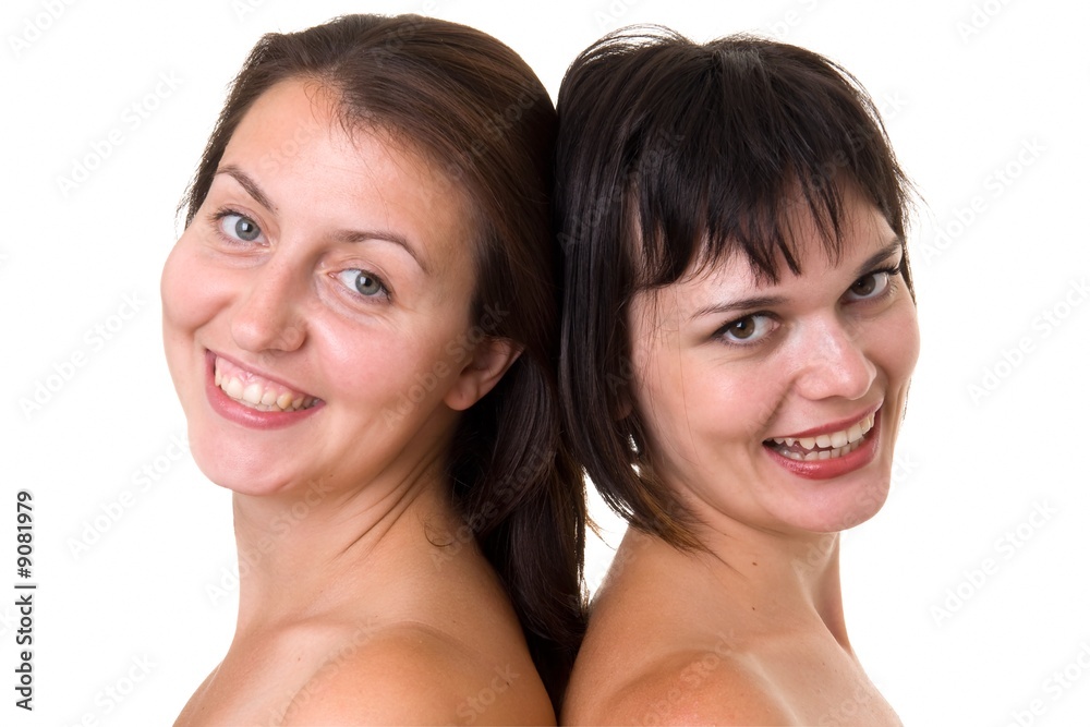 Two smiling women on a white background Two smiling women on a white background