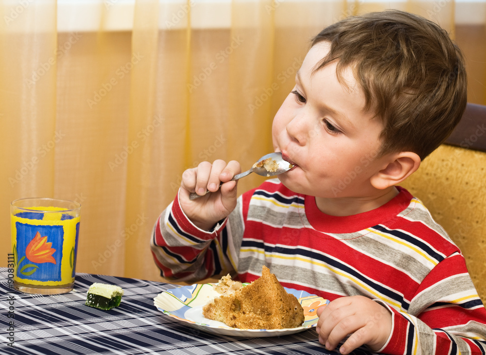 Child eats a tasty pie Child eats a tasty pie