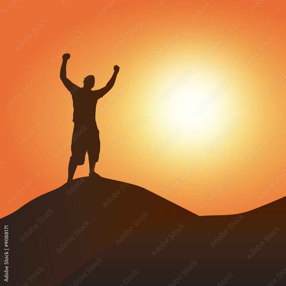 A silhouette of a man atop a mountain with his arms up