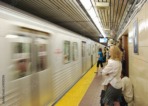 subway train arriving in station photo
