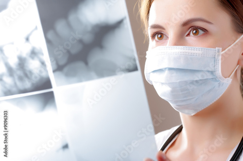 Female doctor examining a colon intestines x ray CT