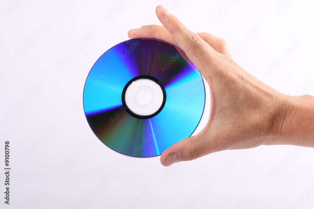 Compact disc in his hand on a white background Compact disc in his hand on a white background
