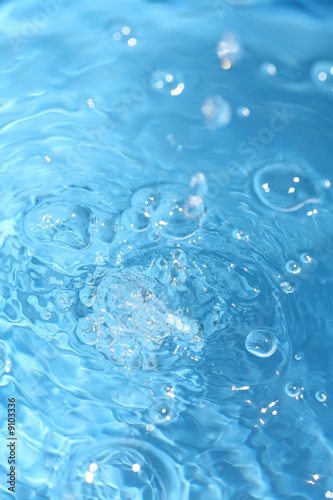 blue water surface closeup, shot in a pool playing with water