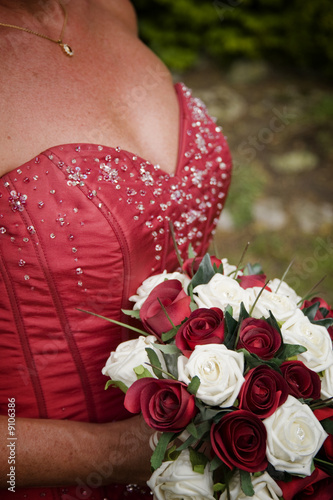 Bride in red wedding dress with bouquet