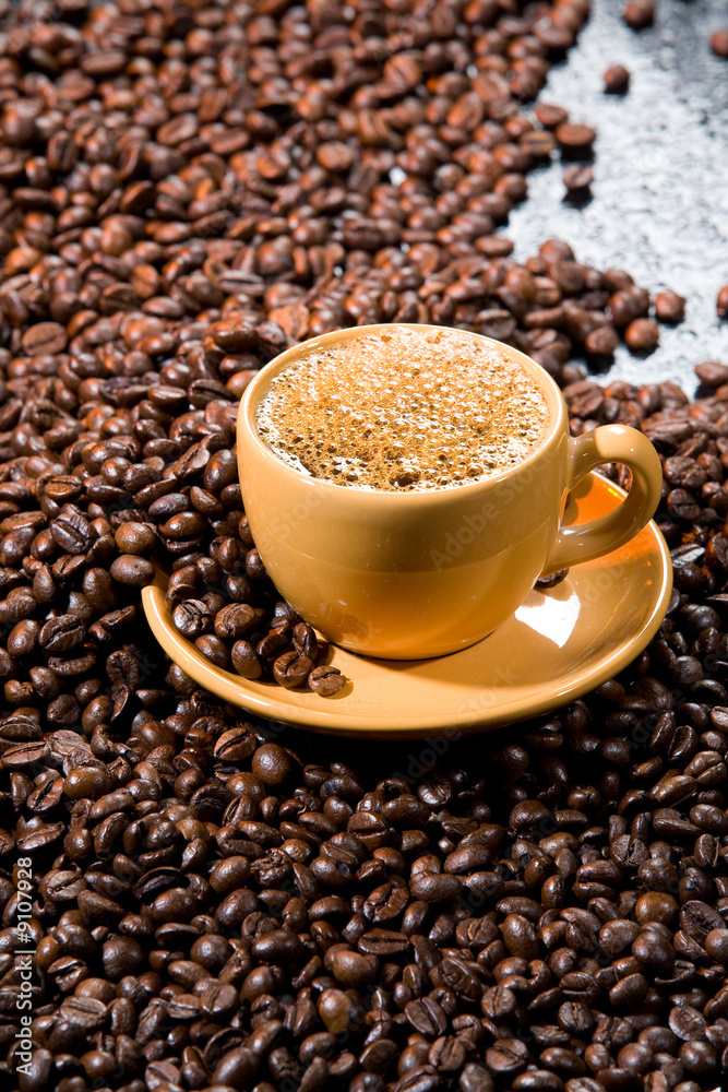Coffee beans on a black glass