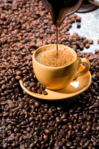 Coffee beans on a black glass