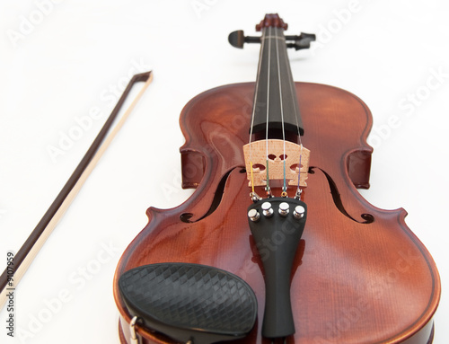Violin and a bow, isolated on a white background.