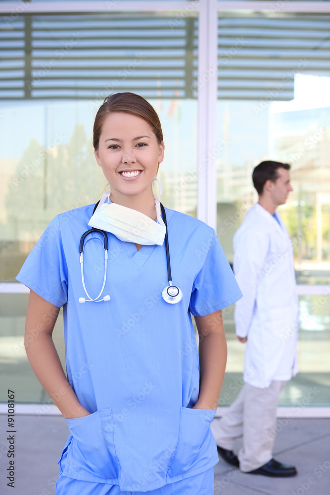 Pretty woman nurse outside hospital office building