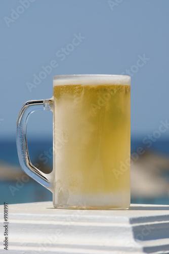 Frozen glass with light beer