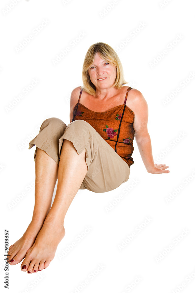 Naklejka premium Senior Lady Sitting Down and Smiling