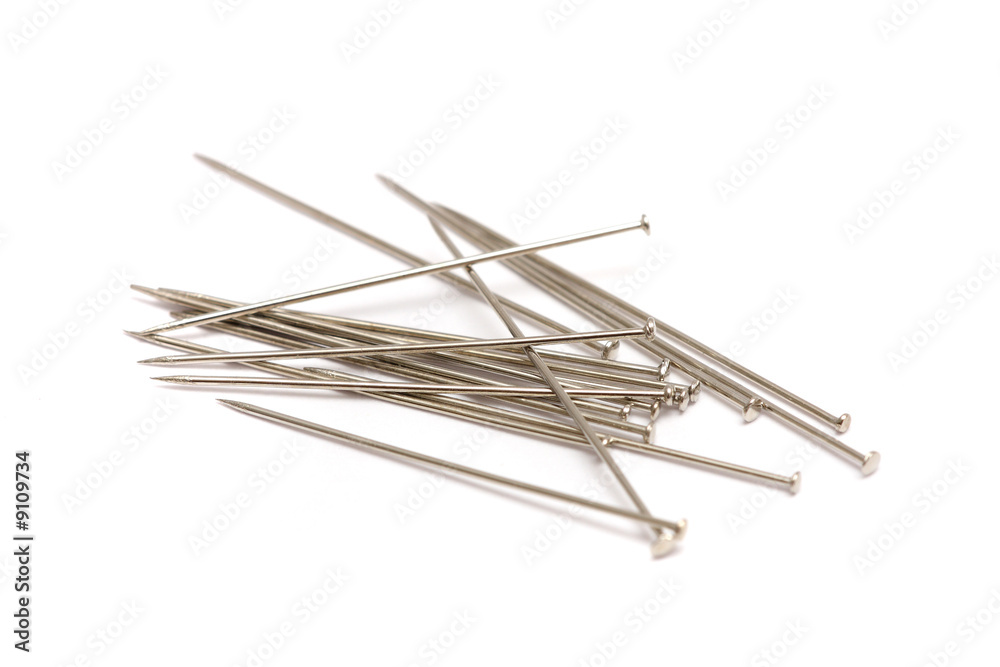 A pile of pins isolated on white background. A pile of pins isolated on white background.
