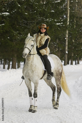 The brunette on a white racehorse