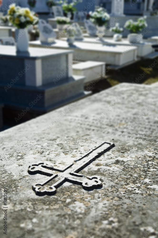 Closeup of a cross engraved in a tombstone in Alentejo, Portugal Closeup of a cross engraved in a tombstone in Alentejo, Portugal