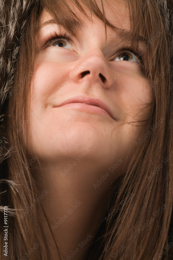 young smiling woman with brown eyes close-up portrait