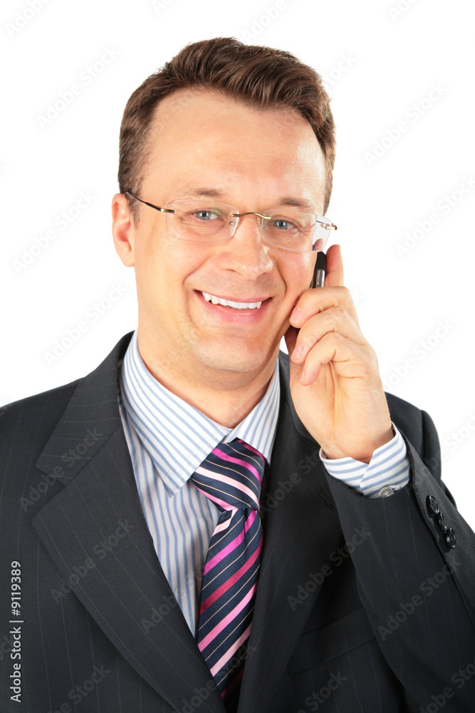 businessman in glasses speaks on cellular telephone businessman in glasses speaks on cellular telephone