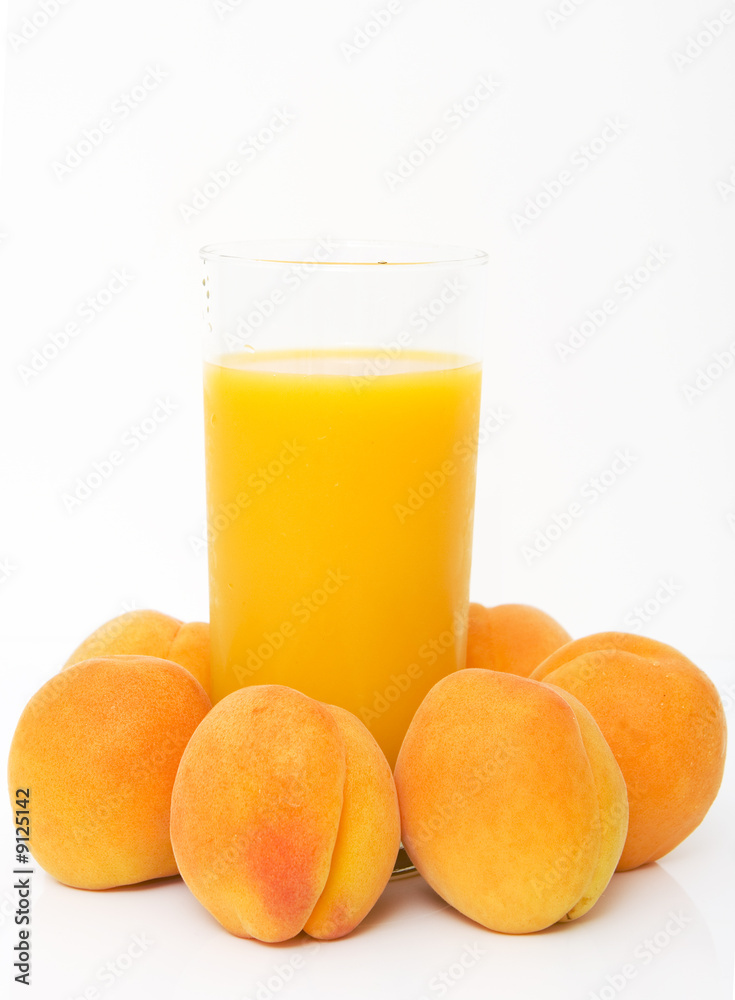 studio shot of fresh apricots with glass of juice studio shot of fresh apricots with glass of juice
