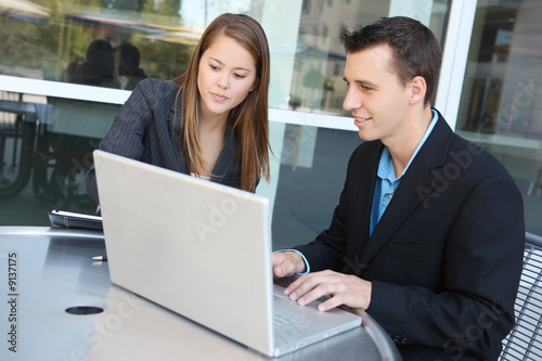 Man and woman business team on laptop computer