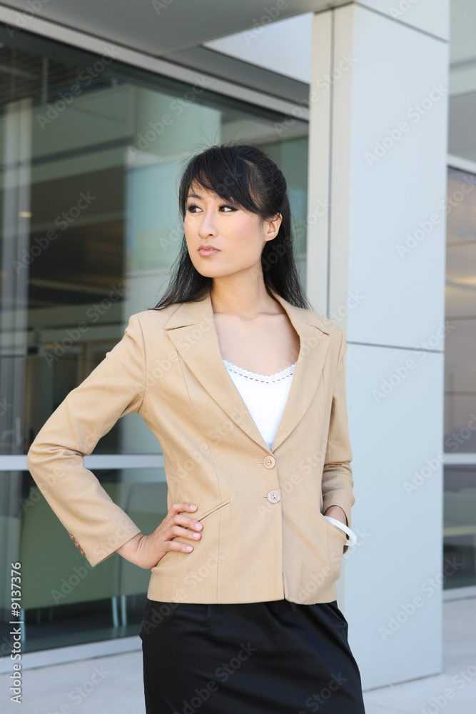 A pretty asian business woman at company office building