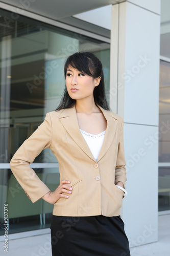 A pretty asian business woman at company office building Free Download A pretty asian business woman at company office building - GFXLoad