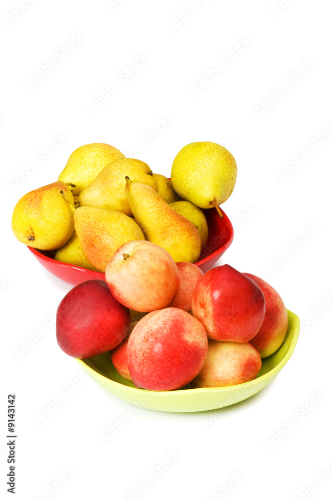 Plates with peaches and nectarines on the white Plates with peaches and nectarines on the white