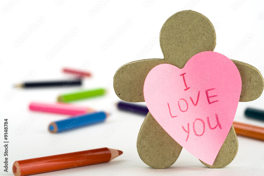 Obraz premium heart shaped note paper, figure and pencils on white background