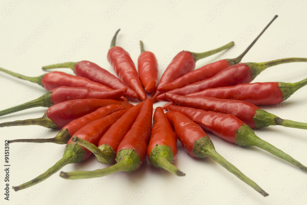 A pile of small red chili peppers isolated