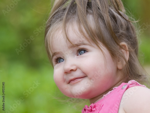 Nice little girl happily smiling